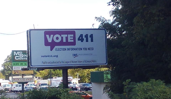 Picture of a roadside billboard with 
VOTE411 logo and url. LWV-RMA logo and information. 